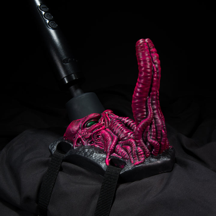 Cthulhu inspired Wand Powered Grinder Sex Toy in pink on a black background