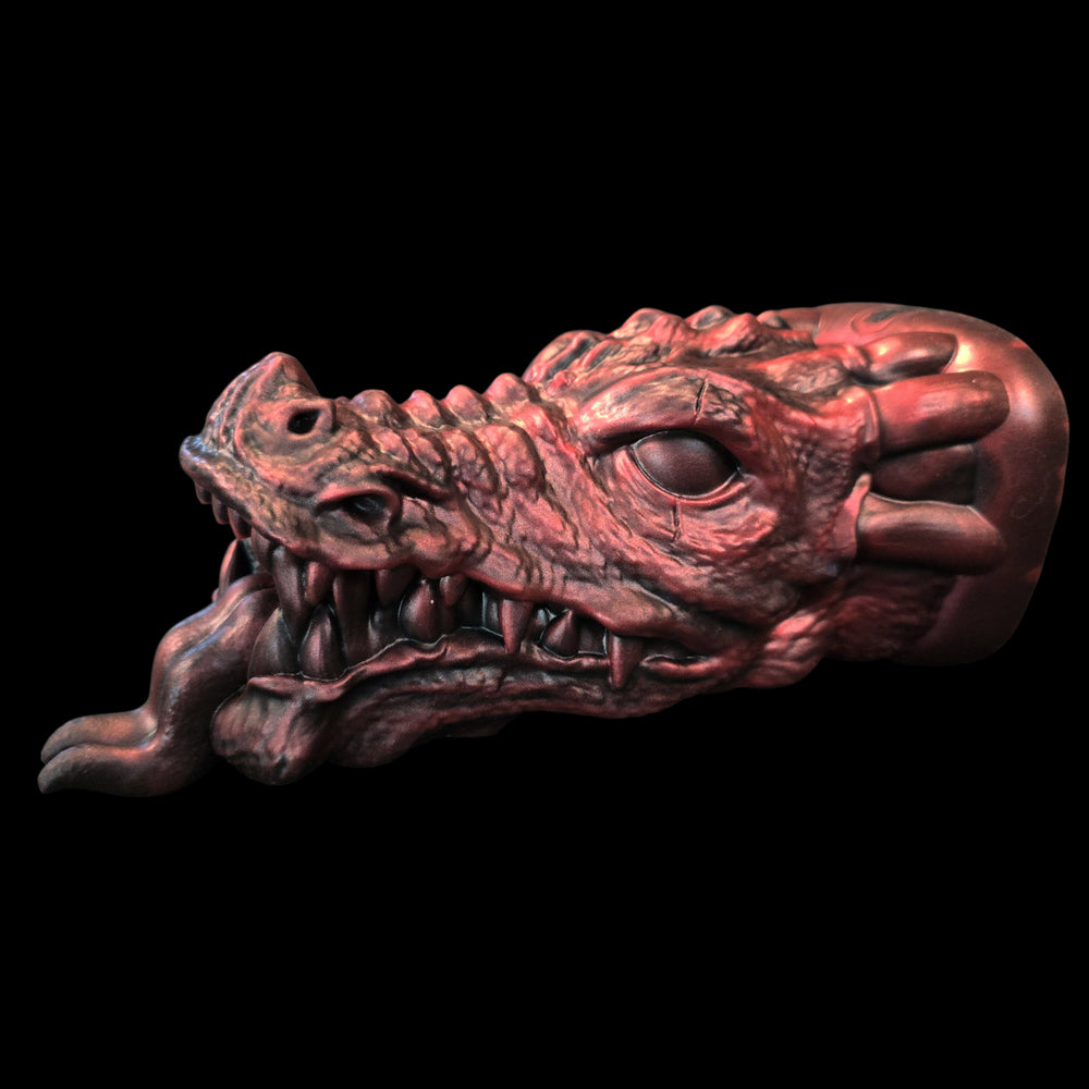 Dragon head sex toy penetrable sculpture on a black background