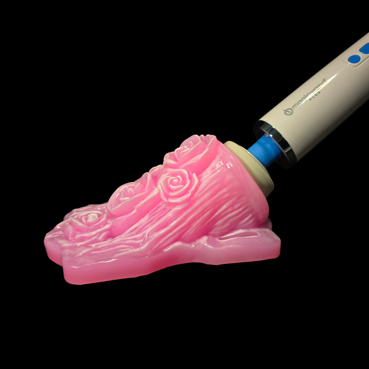 Pink wand grinder sex toy with white highlights