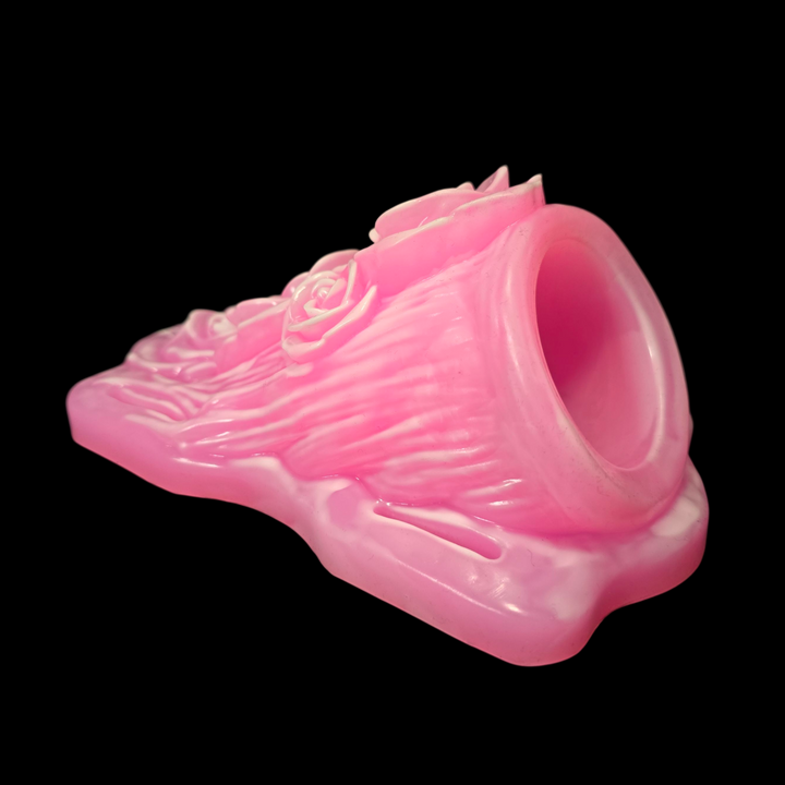 Pink wand grinder sex toy with white highlights showing the cavity in the back for the magic wand massager
