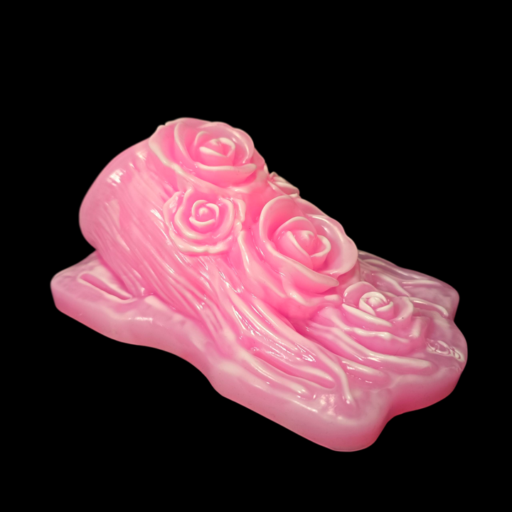 Pink and white grinder sex toy on black background