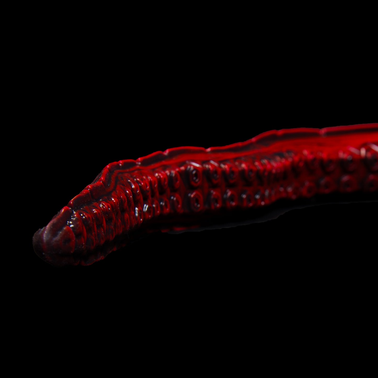 Close up of the tip of the The Sentinel Depth Trainer in red 